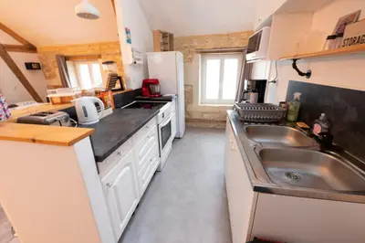 Cuisine ou kitchenette dans l'établissement L’entre deux vignes