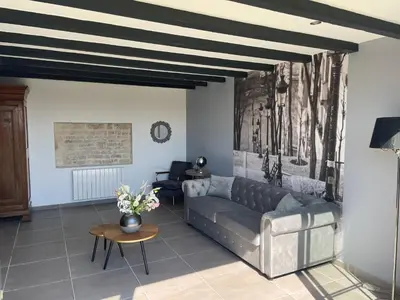 Coin salon dans l'établissement Maison chaleureuse avec parking sur place