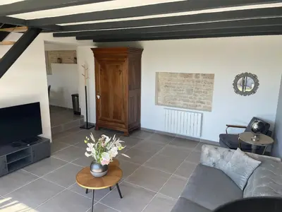 Coin salon dans l'établissement Maison chaleureuse avec parking sur place