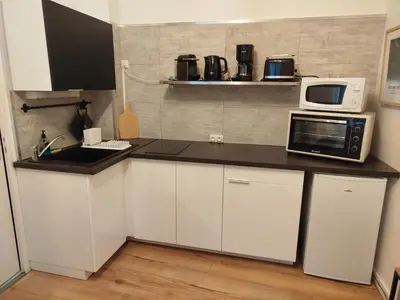 Cuisine ou kitchenette dans l'établissement Le Studio 64