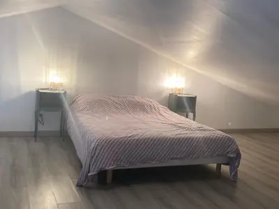 Un ou plusieurs lits dans un hébergement de l'établissement Gîte le verger