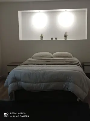 Un ou plusieurs lits dans un hébergement de l'établissement AppartHôtel
