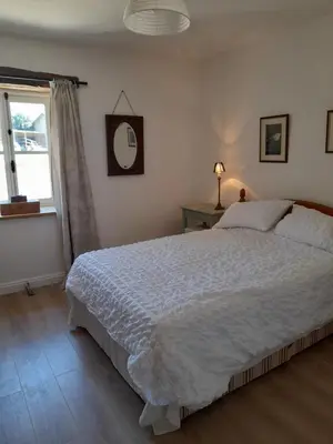 Un ou plusieurs lits dans un hébergement de l'établissement Butterfly Cottage