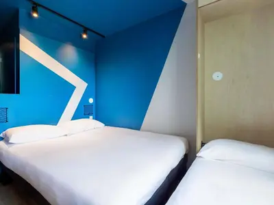Un ou plusieurs lits dans un hébergement de l'établissement ibis Budget La Rochelle Centre gare