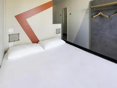 Un ou plusieurs lits dans un hébergement de l'établissement ibis Budget La Rochelle Centre gare