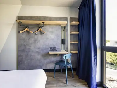 Un ou plusieurs lits dans un hébergement de l'établissement ibis Budget La Rochelle Centre gare