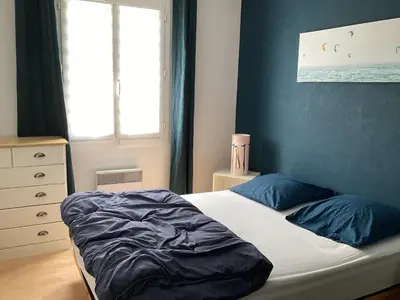 Un ou plusieurs lits dans un hébergement de l'établissement Maison chaleureuse 2 chambres