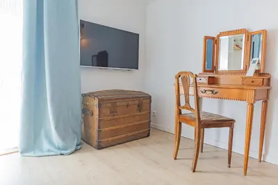 Télévision ou salle de divertissement dans l'établissement Les gîtes du château