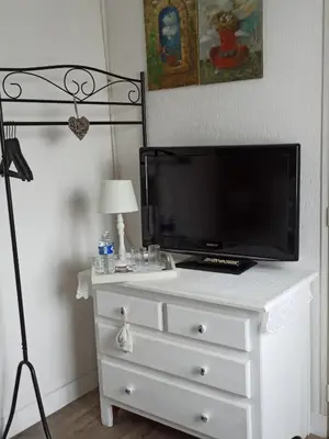 Télévision ou salle de divertissement dans l'établissement Magnolia
