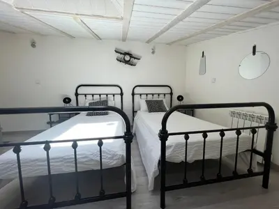 Un ou plusieurs lits dans un hébergement de l'établissement T3 COSY MAISON DE VILLE TERRASSE AU CALME