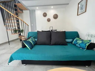 Coin salon dans l'établissement T3 COSY MAISON DE VILLE TERRASSE AU CALME
