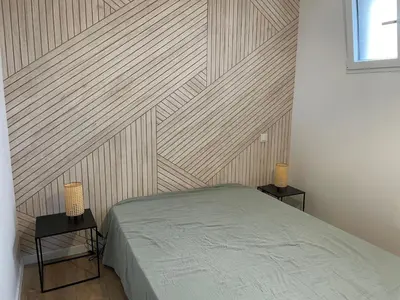 Un ou plusieurs lits dans un hébergement de l'établissement Superbe appartement La Rochelle