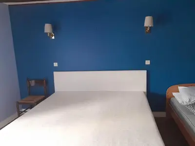 Un ou plusieurs lits dans un hébergement de l'établissement Auberge la marchadaine