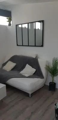Un ou plusieurs lits dans un hébergement de l'établissement Appartement chaleureux à 5 mins de La Rochelle
