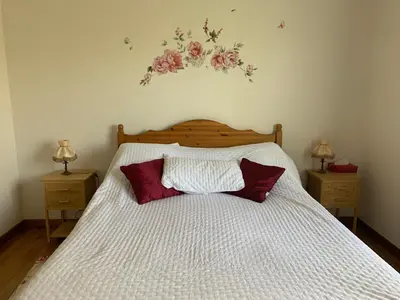 Un ou plusieurs lits dans un hébergement de l'établissement La Maison aux Roses