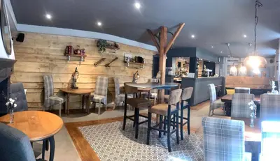 Coin salon dans l'établissement Le Relais D'Aulnay