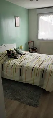 Un ou plusieurs lits dans un hébergement de l'établissement L'Intemporel - Appartement T3 avec jardinet