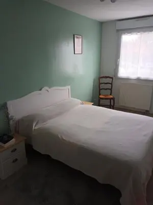 Un ou plusieurs lits dans un hébergement de l'établissement L'Intemporel - Appartement T3 avec jardinet