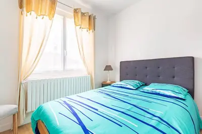 Un ou plusieurs lits dans un hébergement de l'établissement Maison de vacance à 15 minutes de Royan