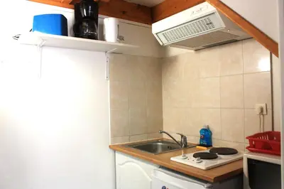 Cuisine ou kitchenette dans l'établissement Chalets Moulière Evasion