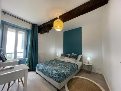 Un ou plusieurs lits dans un hébergement de l'établissement L'escapade de Rompsay Cosy & Moderne