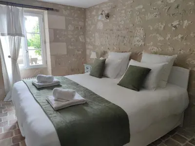 Un ou plusieurs lits dans un hébergement de l'établissement Les Chambres de Moulière