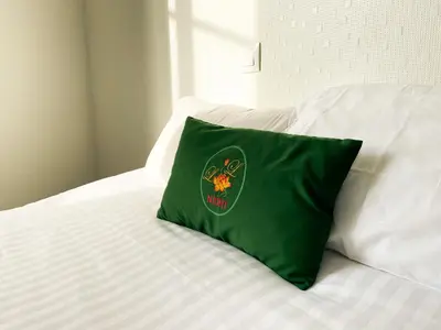 Un ou plusieurs lits dans un hébergement de l'établissement Colette Hôtel