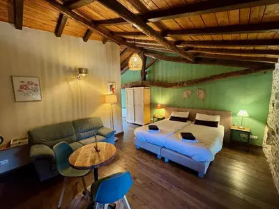 Un ou plusieurs lits dans un hébergement de l'établissement Domaine de Brise Bois - Chambres & Gîtes