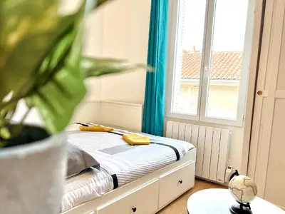 Un ou plusieurs lits dans un hébergement de l'établissement Le Colorado, studio à 5 min du centre-ville