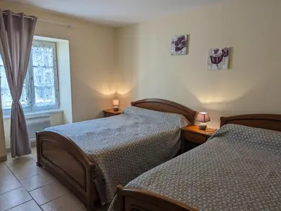 Un ou plusieurs lits dans un hébergement de l'établissement Maison rénovée près d'Angoulême avec jardin privé - FR-1-653-208