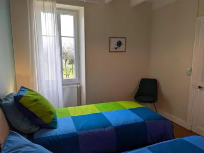 Un ou plusieurs lits dans un hébergement de l'établissement Gîte XVIIIe rénové avec grand jardin, au cœur du vignoble de Cognac - FR-1-653-30