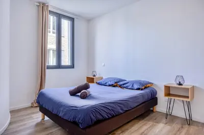 Un ou plusieurs lits dans un hébergement de l'établissement Maison T4 Climatisée avec Jacuzzi à Lagord