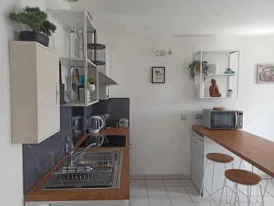 Cuisine ou kitchenette dans l'établissement Faubourg de la Cueille - Aux portes du Futuroscope