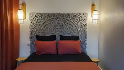 Un ou plusieurs lits dans un hébergement de l'établissement Appart' Nature L'ESCALE - Saintes - Calme, Piscine, Parking, Terrasse