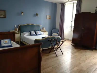 Un ou plusieurs lits dans un hébergement de l'établissement La brasserie chambre d'hotes de Delphine