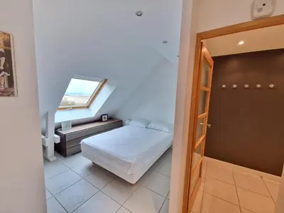 Un ou plusieurs lits dans un hébergement de l'établissement Bel appartement T2 avec balcon, WIFI et parking près de la plage - FR-1-706-2