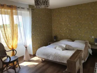 Un ou plusieurs lits dans un hébergement de l'établissement Gîte Au Petit Bonheur
