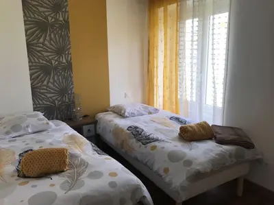Un ou plusieurs lits dans un hébergement de l'établissement Gîte Au Petit Bonheur