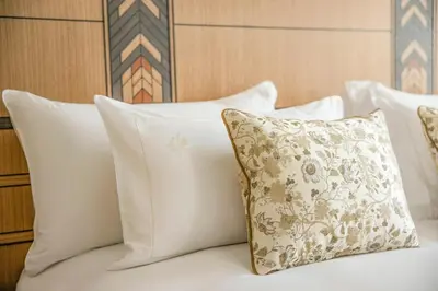 Un ou plusieurs lits dans un hébergement de l'établissement La Nauve, Hôtel & Jardin - Relais & Châteaux