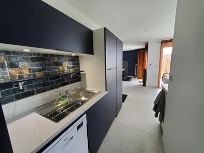 Cuisine ou kitchenette dans l'établissement Hortensia, Gîte famille et amis