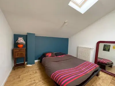 Un ou plusieurs lits dans un hébergement de l'établissement appartement Loft-atelier à Vivonne