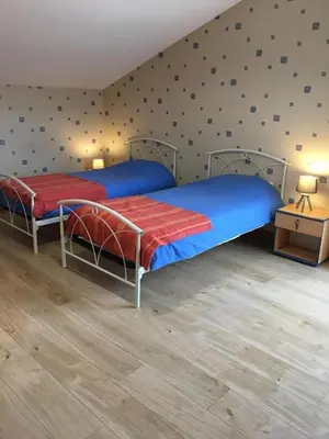 Un ou plusieurs lits dans un hébergement de l'établissement La ferme d'ernest