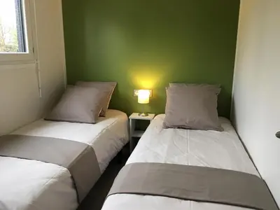 Un ou plusieurs lits dans un hébergement de l'établissement Pistache la vallee des noyers