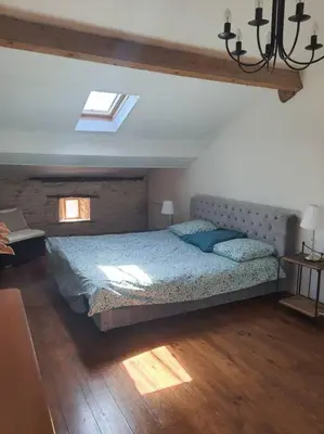 Un ou plusieurs lits dans un hébergement de l'établissement Appartement duplex 4 personnes