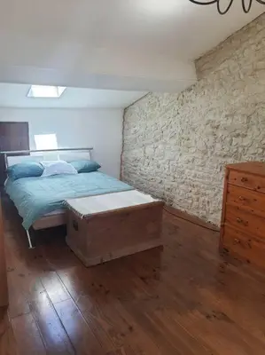 Un ou plusieurs lits dans un hébergement de l'établissement Appartement duplex 4 personnes