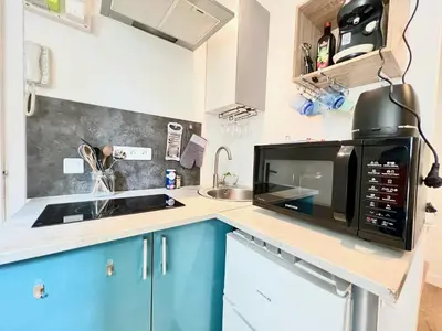 Cuisine ou kitchenette dans l'établissement L'Arizona, Studio à 5 minutes du centre-ville