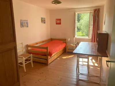 Un ou plusieurs lits dans un hébergement de l'établissement Gite des Noisettes à la porte de Saintes