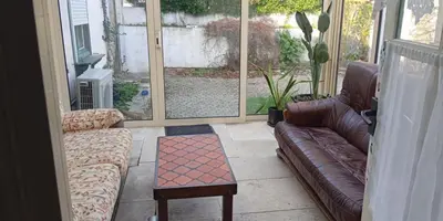 Coin salon dans l'établissement Maison 4 chambres avec jardin