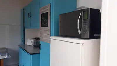 Cuisine ou kitchenette dans l'établissement Maison de vacances familiale